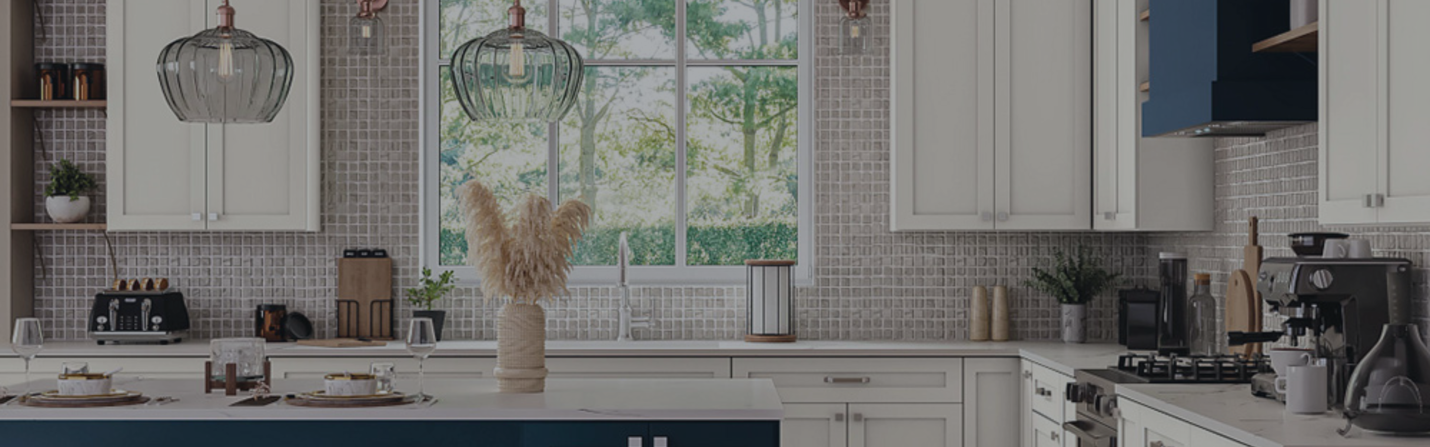 Small mosaic tile on a kitchen wall with white and blue cabinetry