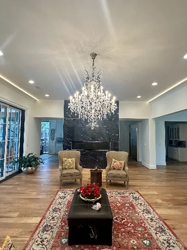 Northport living room with hardwood installation and chandelier 